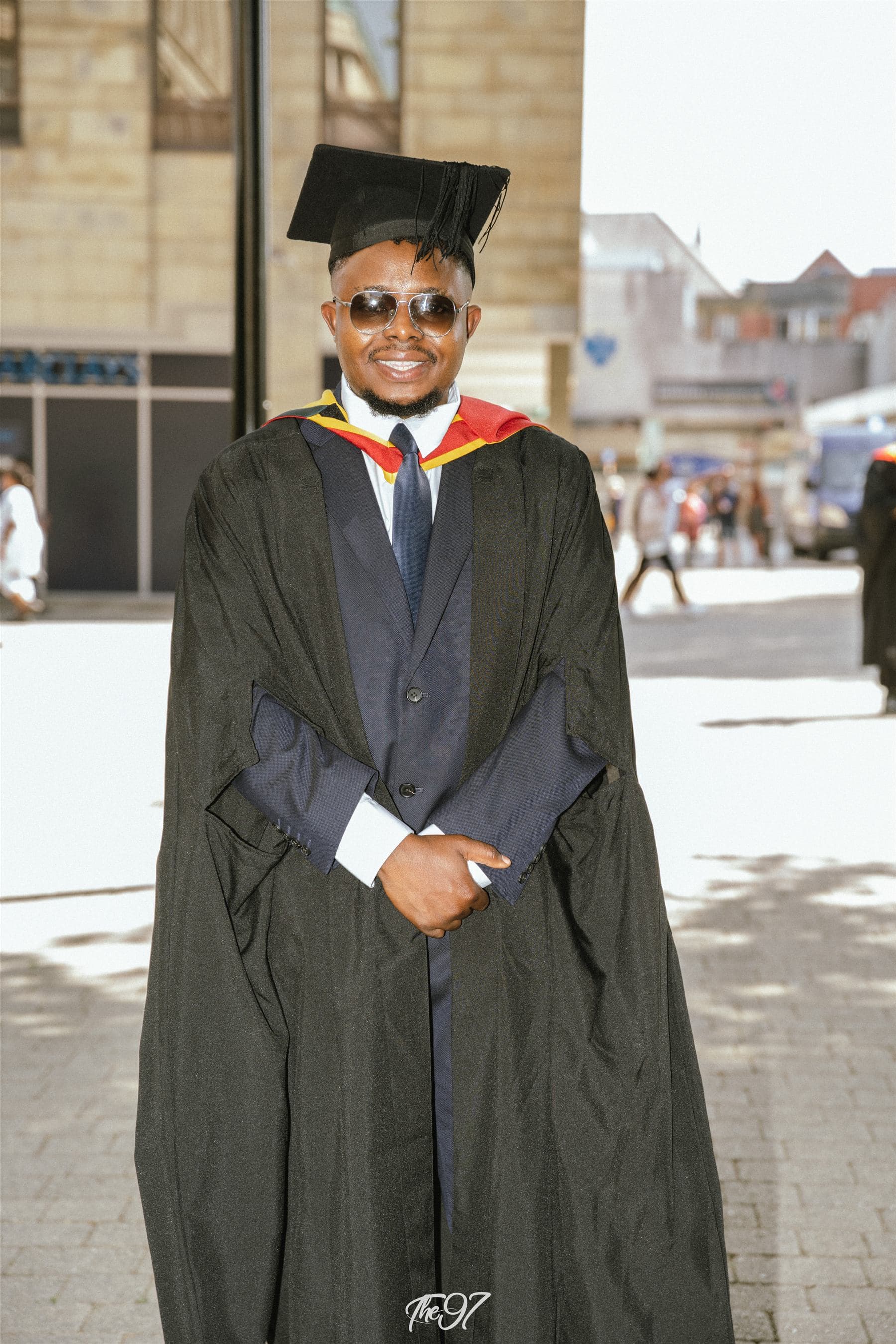 Àlọbọ̀ Travels graduate in cap and gown after his UK ceremony